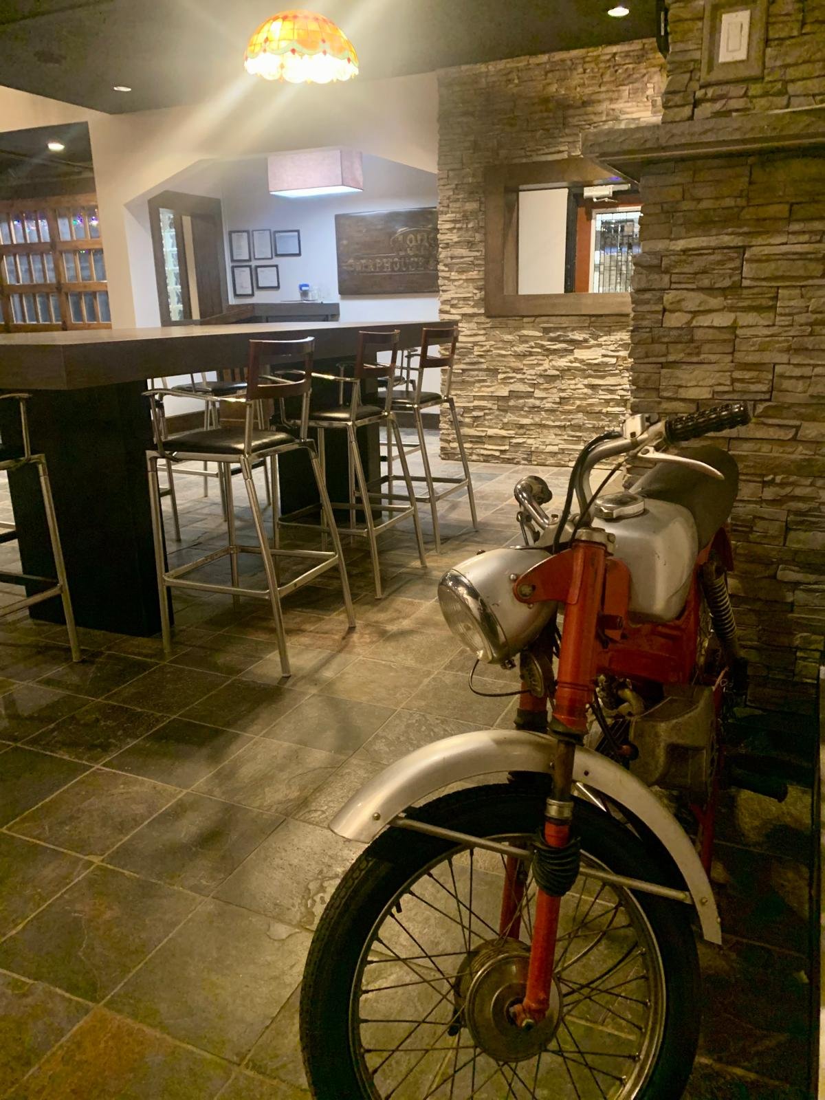 Vintage motorcycle on display in the 1979 bar lounge